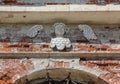 Decorative cherub on the brick wall of an abandoned temple