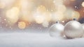 Decorative christmas baubles in snowfall against bokeh background. Selective focus and shallow depth of field Royalty Free Stock Photo