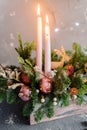 Decorative christmas composition with pink candle with small christmas balls and pine Royalty Free Stock Photo
