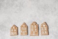 Decorative Christmas food pattern. Winter composition of old house shaped gingerbread cookies with sugar icing on grunge Royalty Free Stock Photo