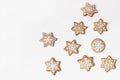 Decorative Christmas food pattern. Winter composition of star shaped gingerbread cookies with sugar icing isolated on Royalty Free Stock Photo