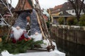 decorative christmas gnome in the street in border water