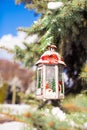 Decorative Christmas lantern on fir branch in snow Royalty Free Stock Photo