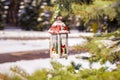 Decorative Christmas lantern on fir branch in snow Royalty Free Stock Photo