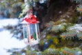 Decorative Christmas lantern on fir branch in snow Royalty Free Stock Photo