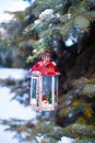 Decorative Christmas lantern on fir branch in snow Royalty Free Stock Photo