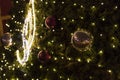 Decorative christmas ornaments baubles on green evergreen branches of a coniferous tree at the christmas markets in Prague Royalty Free Stock Photo