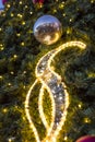 Decorative christmas ornaments baubles on green evergreen branches of a coniferous tree at the christmas markets in Prague Royalty Free Stock Photo