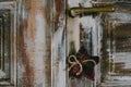 Decorative christmas star hanging on the old door handle Royalty Free Stock Photo