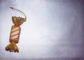 Decorative Christmas toy candy lies on  silver background Royalty Free Stock Photo
