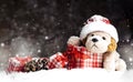 Decorative Christmas toy-dog, gifts in the snow Royalty Free Stock Photo