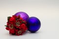 Decorative Christmas tree baubles in blue and purple with an ornate red and one floral one Royalty Free Stock Photo