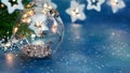Decorative christmas tree glass ball on background of glowing christmas lights Royalty Free Stock Photo