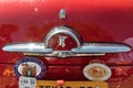 Decorative chrome logo and badges on a vintage Mercury Monterey