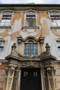 Decorative classicistic house gate on old decaying historical town house in Esztergom, Hungary