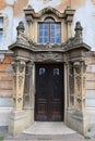 Decorative classicistic house gate on old decaying historical town house in Esztergom, Hungary.