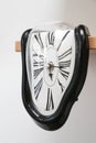 Decorative clocks drain off the shelf. The clock is a symbol of the impermanence of time. Royalty Free Stock Photo