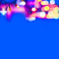 Decorative Colorful Blurred Christmas Lights On Blue Background. Abstract Soft Lights. Colorful Bright Circles Of A Sparkling Garl