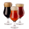 Decorative composition of different beer in wineglasses with foam - lager, red ale, porter - isolated on white background.