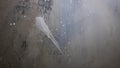 Decorative concrete wall in paint and paint drops, wall texture in scratches.