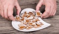 Female hands and preparation of sweet gingerbreads for good luck