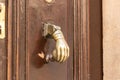 Decorative copper handle in the form of a human hand on the outer door of a building on the Via Dolorosa Street in the old city