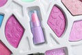 Decorative cosmetics for kids. Eye shadow palette with lipstick as background, top view