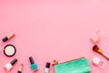 Decorative cosmetics for make up on pink desk background top view mock up