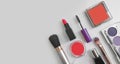 Decorative cosmetics, mascara, lipstick, frame on a colored fashion d