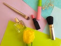 Decorative cosmetics, tulip flower  perfume  on a colored background Royalty Free Stock Photo