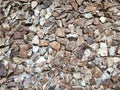 Decorative cracked real stone wall surface with cement Royalty Free Stock Photo