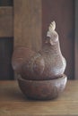 Decorative crafting brown wooden chicken figurine, handmade souvenir in Asia for home decoration