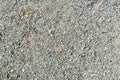 Decorative crushed gray pieces fine gravel stones for construction industry. Stones background. Top view. Abstract texture.