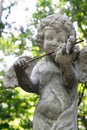 Decorative cupid playing violin sculpture Royalty Free Stock Photo