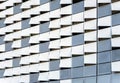 Decorative curved and perforated metal elements of the exterior wall of modern building