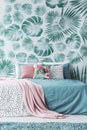 Turquoise bed by leaves wallpaper Royalty Free Stock Photo