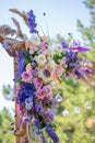 Decorative decoration of the wedding arch with fresh flowers. Holding a wedding ceremony in the open. Decoration details Royalty Free Stock Photo