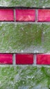 Decorative design on the facade of the house with red brick and green plaster. Royalty Free Stock Photo