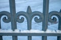 decorative detail of metallic spearhead gate in winter Royalty Free Stock Photo