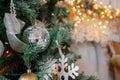 Decorative disco ball close-up. Decorated Christmas tree on blurred, sparkling fairy background