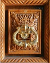 Decorative door handle knocker architecture on wood