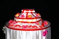 Decorative dummy cake with flowers and red ribbons Royalty Free Stock Photo