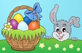 Decorative egg basket and lurking bunny Royalty Free Stock Photo