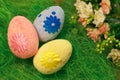 Decorative eggs on green grass. Chicken basket. Concepts Easter, eggs, hand made Royalty Free Stock Photo