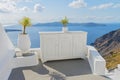 Decorative elements adorn traditional Greek house. Therasia on backdrop. Santorini ( Thira ) island Royalty Free Stock Photo