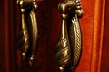 Decorative elements of the carved mahogany cabinet.