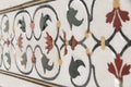 Decorative elements created by applying paint, stucco, stone inlays and carvings