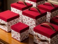 Decorative fabric storage boxes with red lids and handles Royalty Free Stock Photo