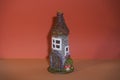 Decorative fairy tale house tower made of bottle and paper. Diy with your own hands