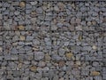 Decorative fence of bulk stone in the grid Royalty Free Stock Photo